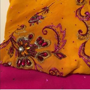 Beautiful yellow and pink sari and blouse set.